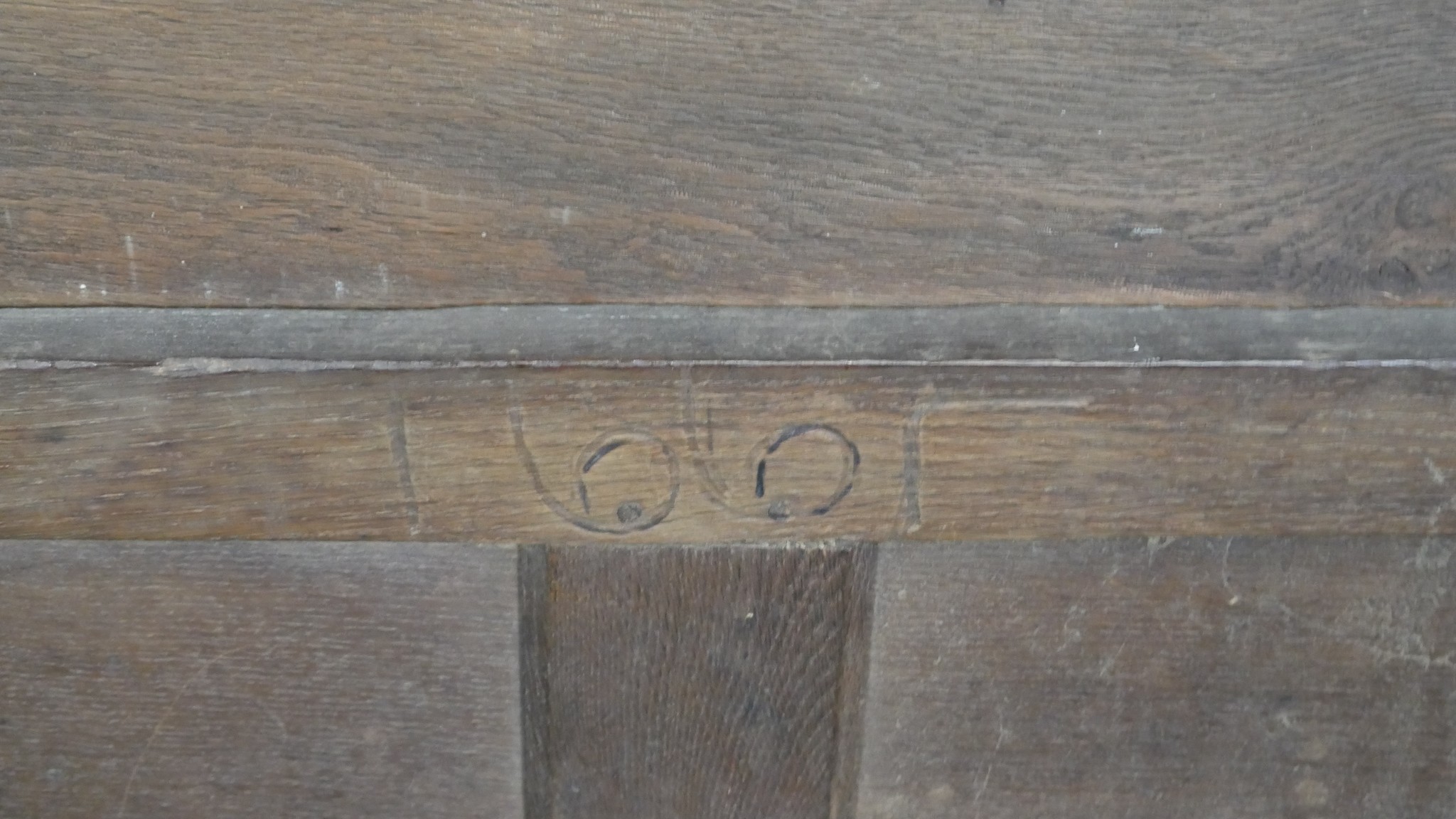 A 17th century oak coffer with lozenge carved panels raised on stile supports. H.54 W.104 D.49cm - Image 7 of 11