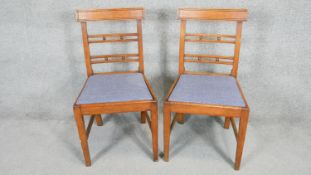 A pair of 19th century mahogany bar back dining chairs with drop in seats on square tapering