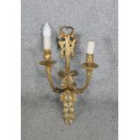 A Victorian gilt metal two branch foliate and bow design wall sconce. L.52 CM