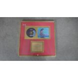 A framed and glazed presentation disc for the sale of 400,000 copies of Brimful of Asha by