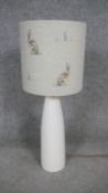 A contemporary cream ceramic table lamp with Hartley Hare fabric lamp shade with brushed gold