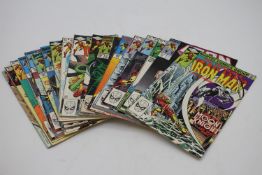 A collection of seventeen vintage Marvel The Invincible Iron Man comics in protective sleeves.