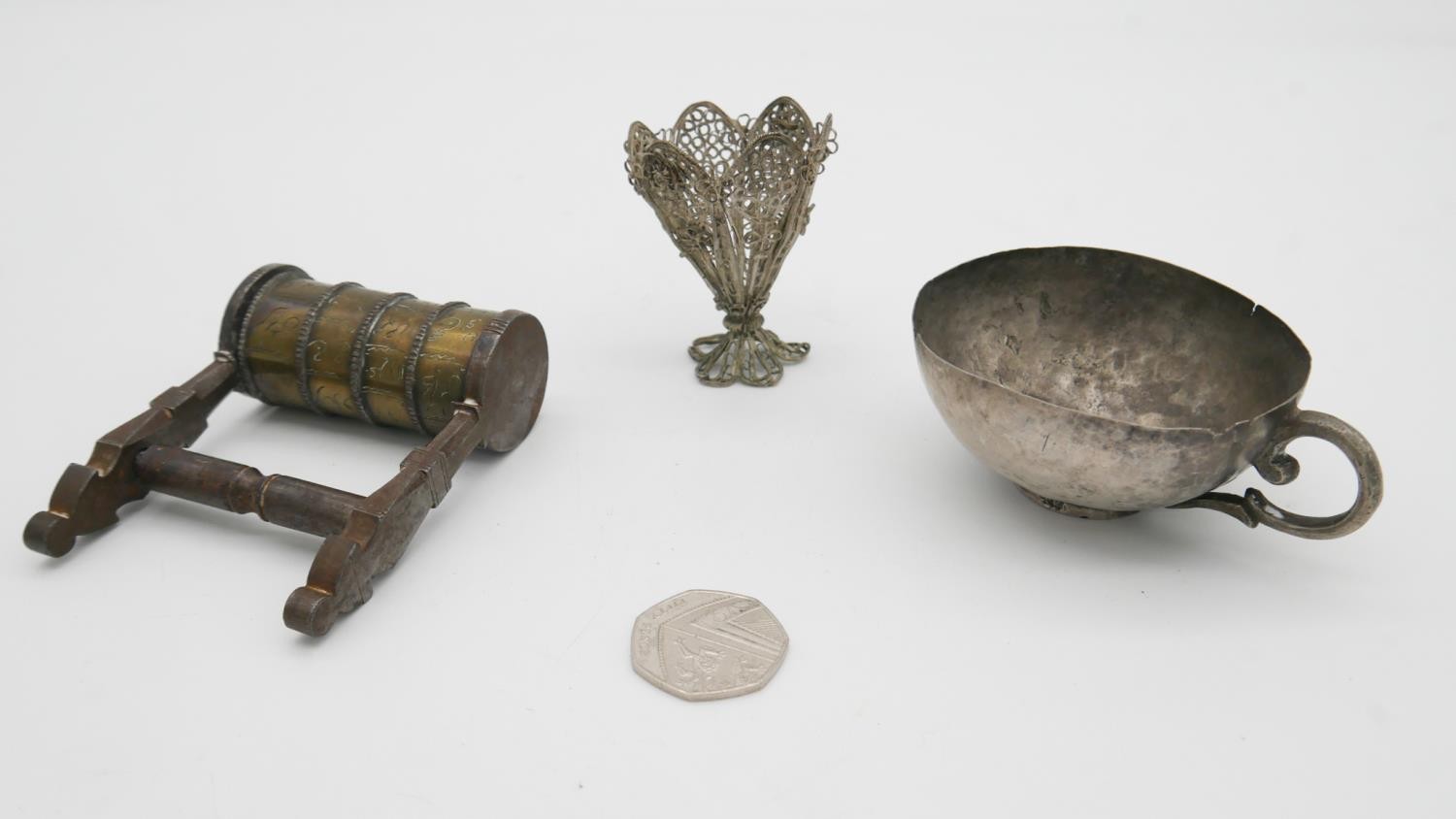 A white metal tea cup and filigree miniature vase along with a brass Islamic puzzle lock. H.10 W. - Image 2 of 5