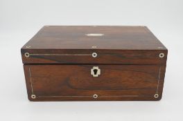 A 19th century rosewood mother of pearl inlaid box of curiosities. Including three geodes,