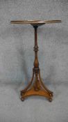 A 19th century mahogany and satinwood strung Empire style lamp table table with central inlaid fan