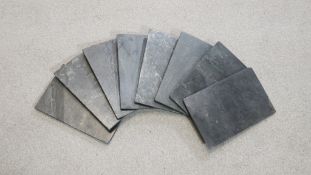 Eight rectangular slate place mats. L.18 W.28cm