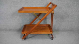 A vintage folding two tier trolley with maker's label. H.70 L.70 D.40cm