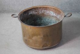 A large Victorian copper twin handled conserve pan. H.38 Diam. 60 cm.