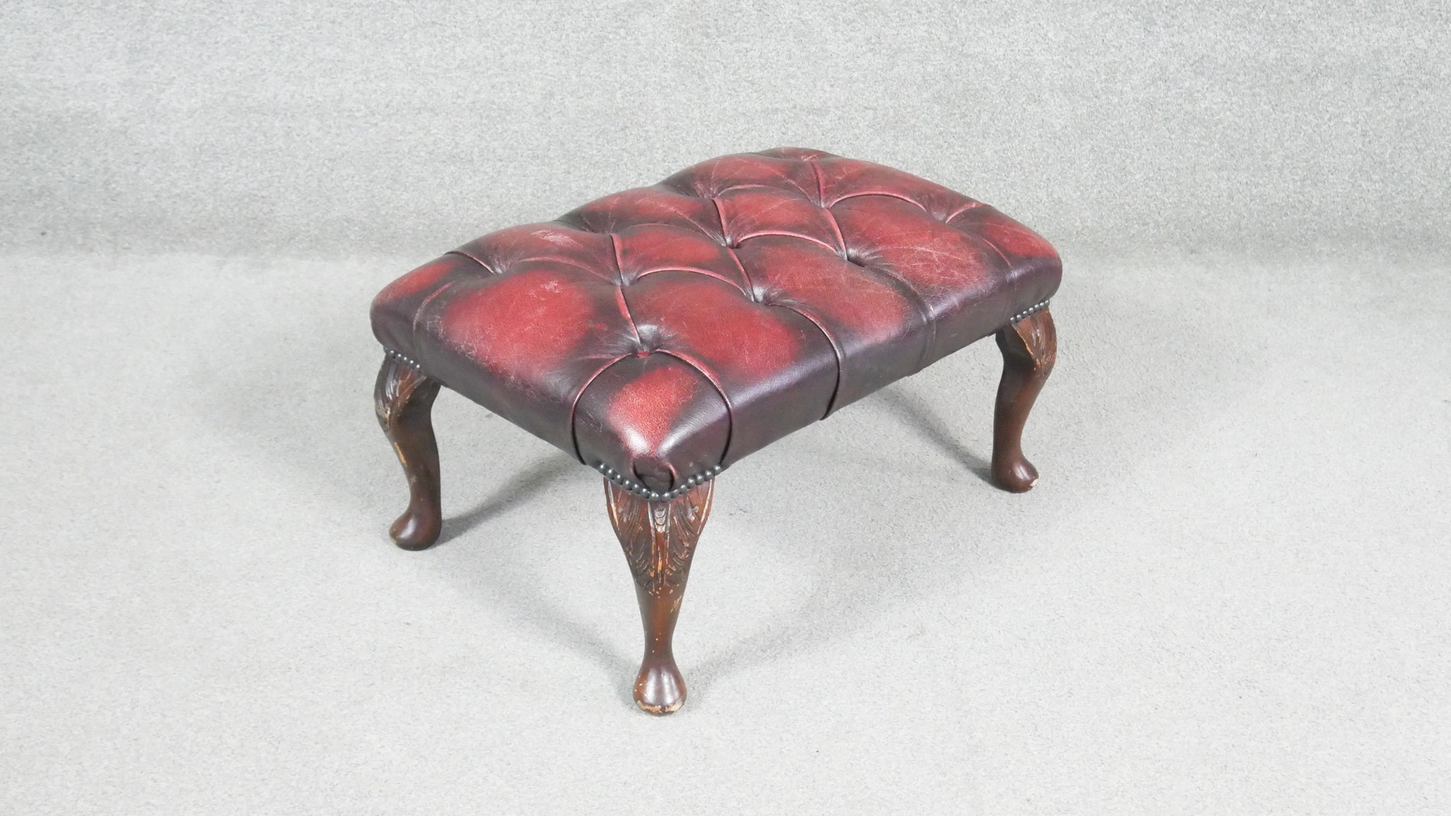 A Georgian style stool in deep buttoned leather upholstery on cabriole supports. H.20 W.65 D.43cm - Image 4 of 6