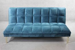 A contemporary futon style sofa bed in velour upholstery on chrome supports. H.80 W.166 D.45 cm.