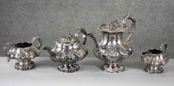 A four piece Georgian repousse silver tea set by Jonathan Hayne. The set has a foliate and floral