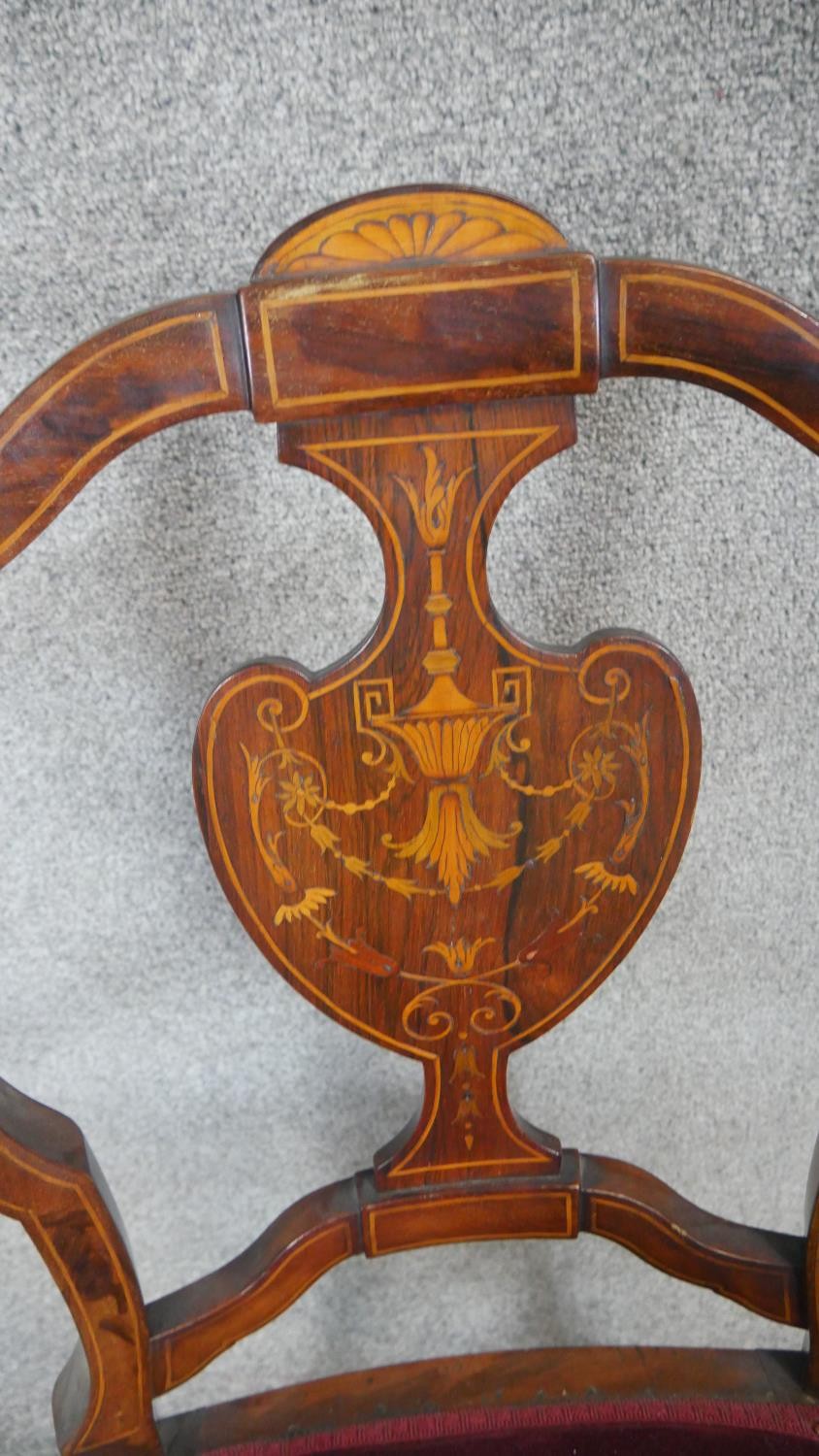 A pair of late 19th century rosewood armchairs with satinwood swag and urn inlay on square - Image 4 of 4