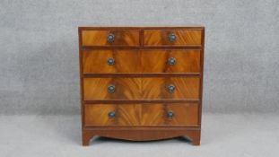 A small Georgian style flame mahogany chest of drawers on shaped apron and bracket feet. H.76 W.76