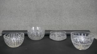 Four heavy hand cut crystal fruit bowls. Each with a different bold geometric pattern and star cut