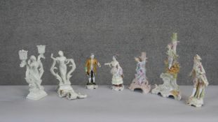 A collection of hand painted porcelain figures. Including two Capodimonte figurines, one of a male