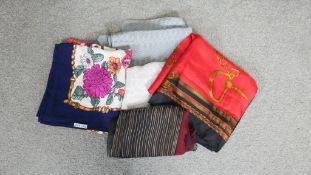 Five designer silk scarves. Including a Ralph Lauren orange and navy equestrian design silk scarf, a
