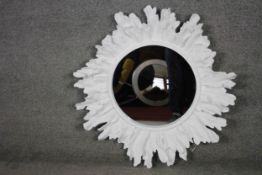 A large organic sculptural sunburst design fibreglass wall mirror. 87cm diameter.