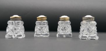 Hroar Prydz - Four silver gilt Norwegian cut crystal salt and pepper shakers with cream guilloche