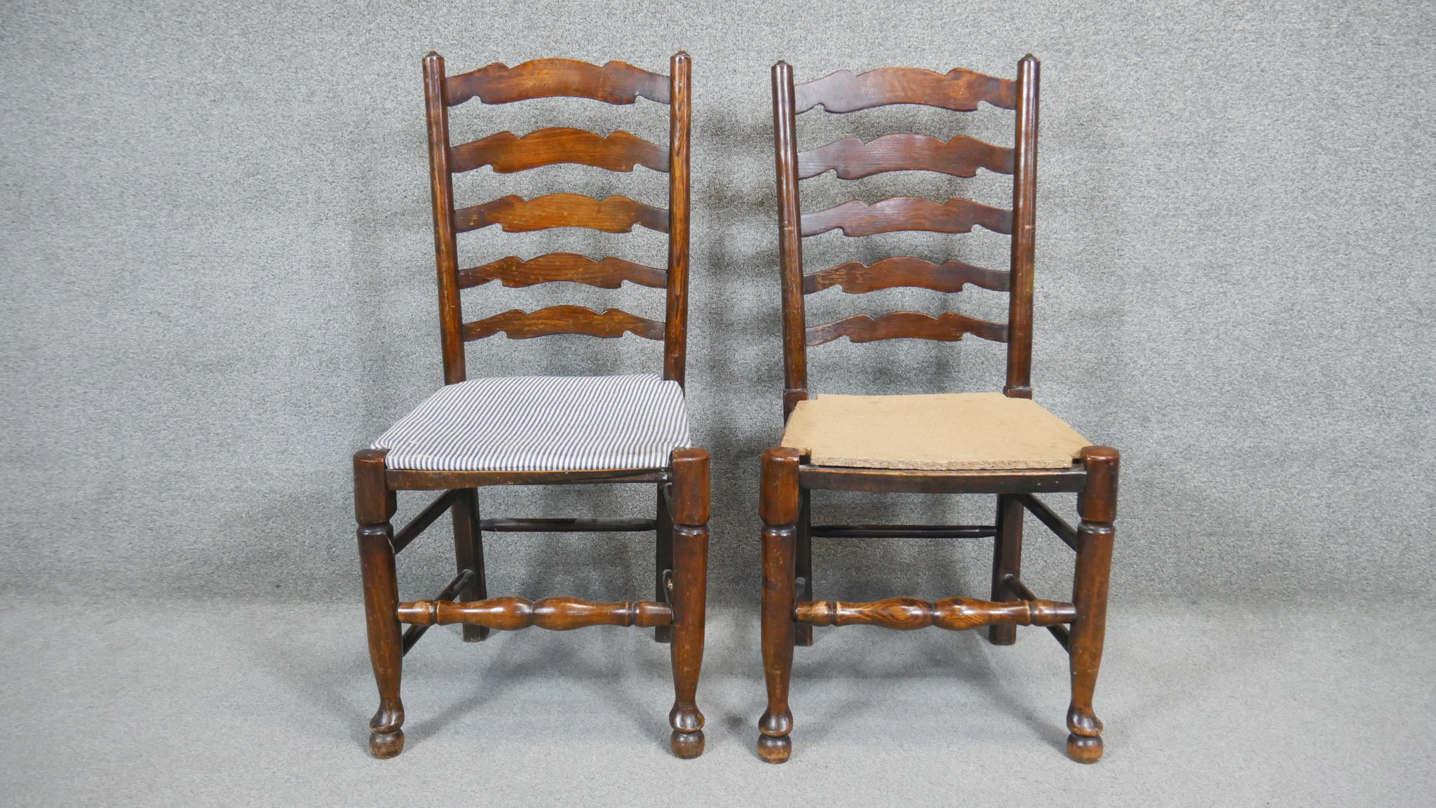 A pair of oak Lancashire style ladder back dining chairs. (Each with temporary panel seat).