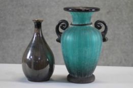 A Murano turquoise and black twin handled blown glass vase along with a brown glaze bottle vase.