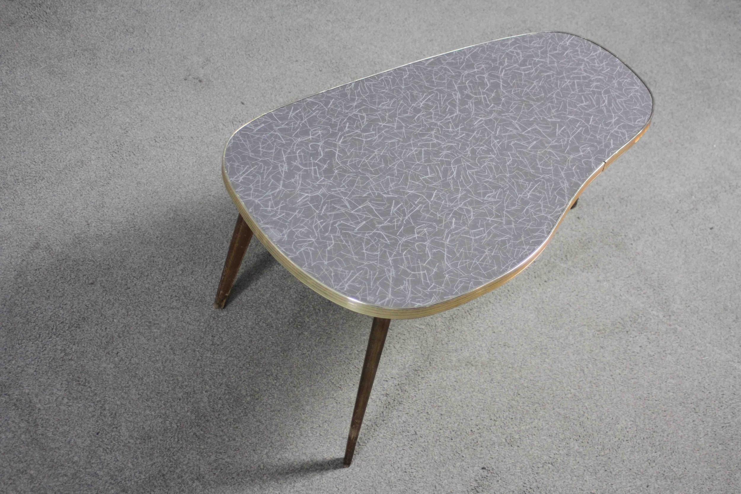 A mid century shaped coffee table with composite laminated top on splay supports. H.34 W.76 D.43 - Image 3 of 3