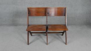 A pair of vintage oak folding church or cinema seats. H.80 W.95 D.55cm