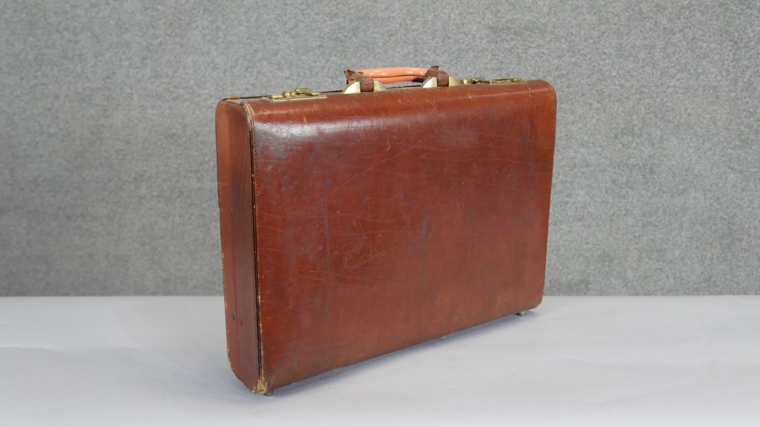 A vintage tan leather brief case with multi partitioned ostrich skin interior and brass hardware. - Image 2 of 6
