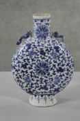 A Chinese late 19th - early 20th Chinese blue and white hand painted stylised floral design