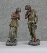 Two vintage painted spelter figures. One of a young female with apron and headscarf the other of a
