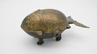 An Indian brass Pandan box in the shape of a fish, partitions inside. H.8 W.16