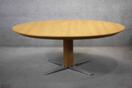 A contemporary light oak Team 7 Girado extending dining table with integral fold out central