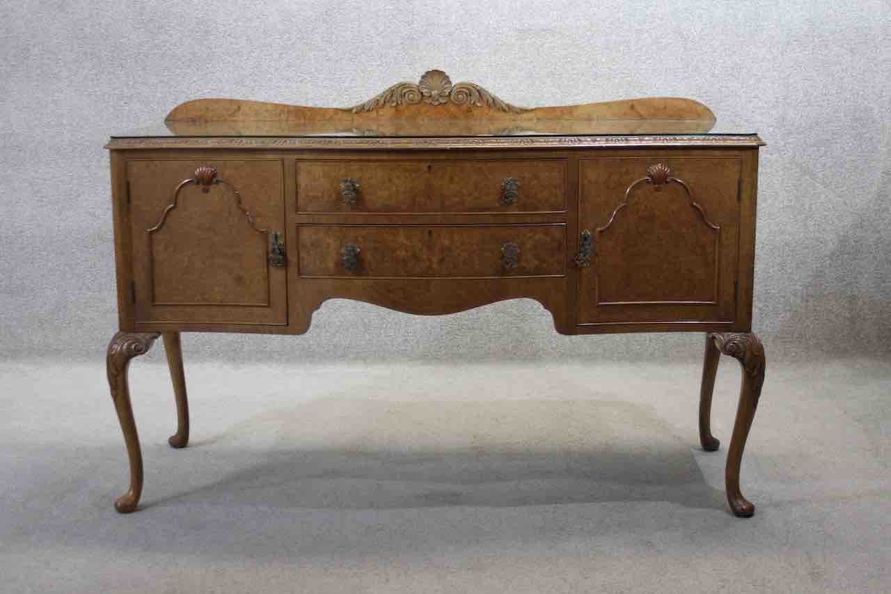 A mid century burr walnut Epstein sideboard with central drawers flanked by cupboards on carved - Image 2 of 8