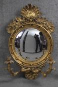 A Regency style gilt framed girandole with convex plate and foliate decoration and twin scrolling