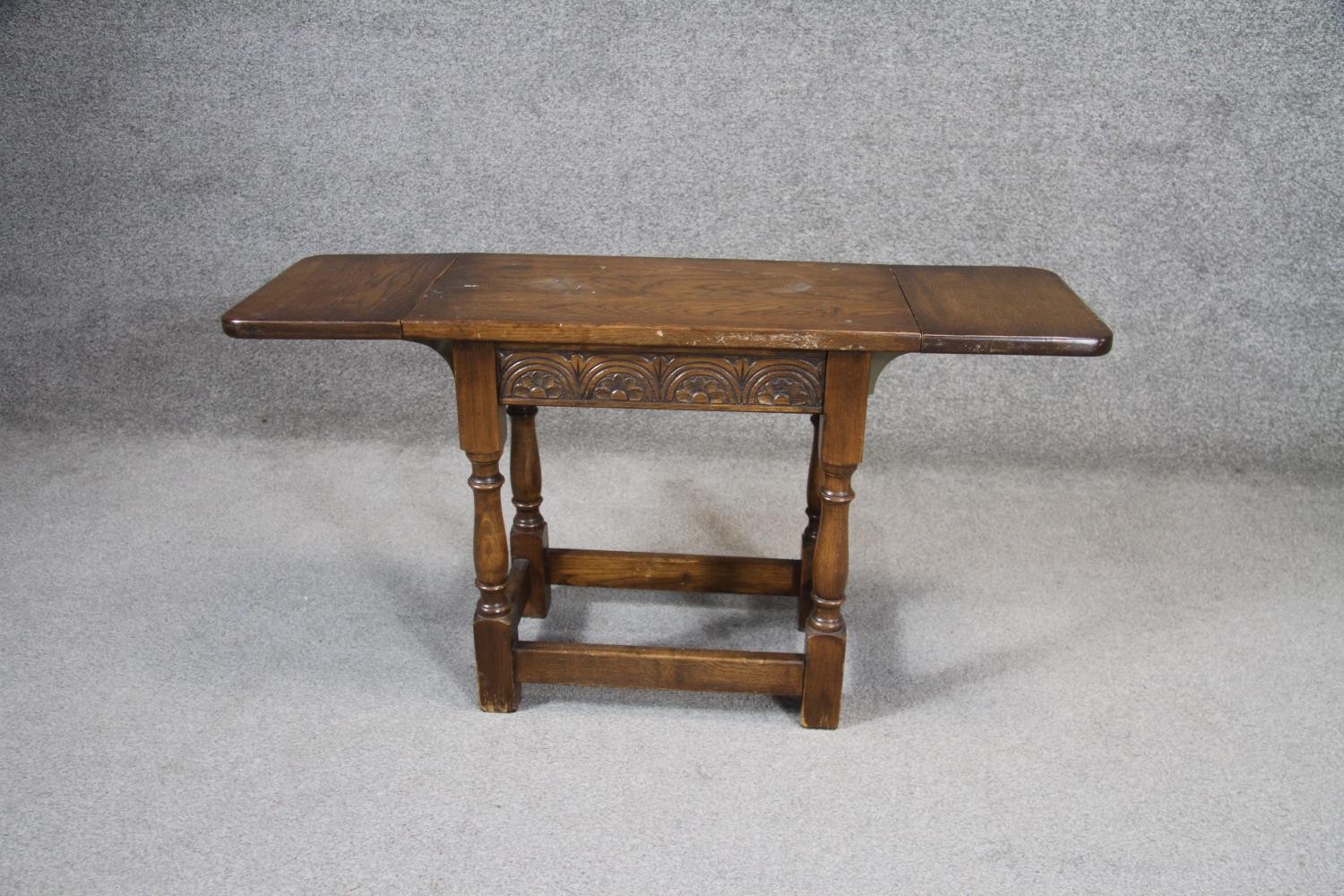 A small mid century oak Jacobean style twin drop flap occasional table with carved frieze on - Image 3 of 4