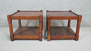 A pair of stained hard wood occasional tables on square chamfered supports united by undertier. H.40