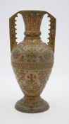 An Oriental gilt metal enamelled twin handled vase. Decorated with a stylised floral and foliate