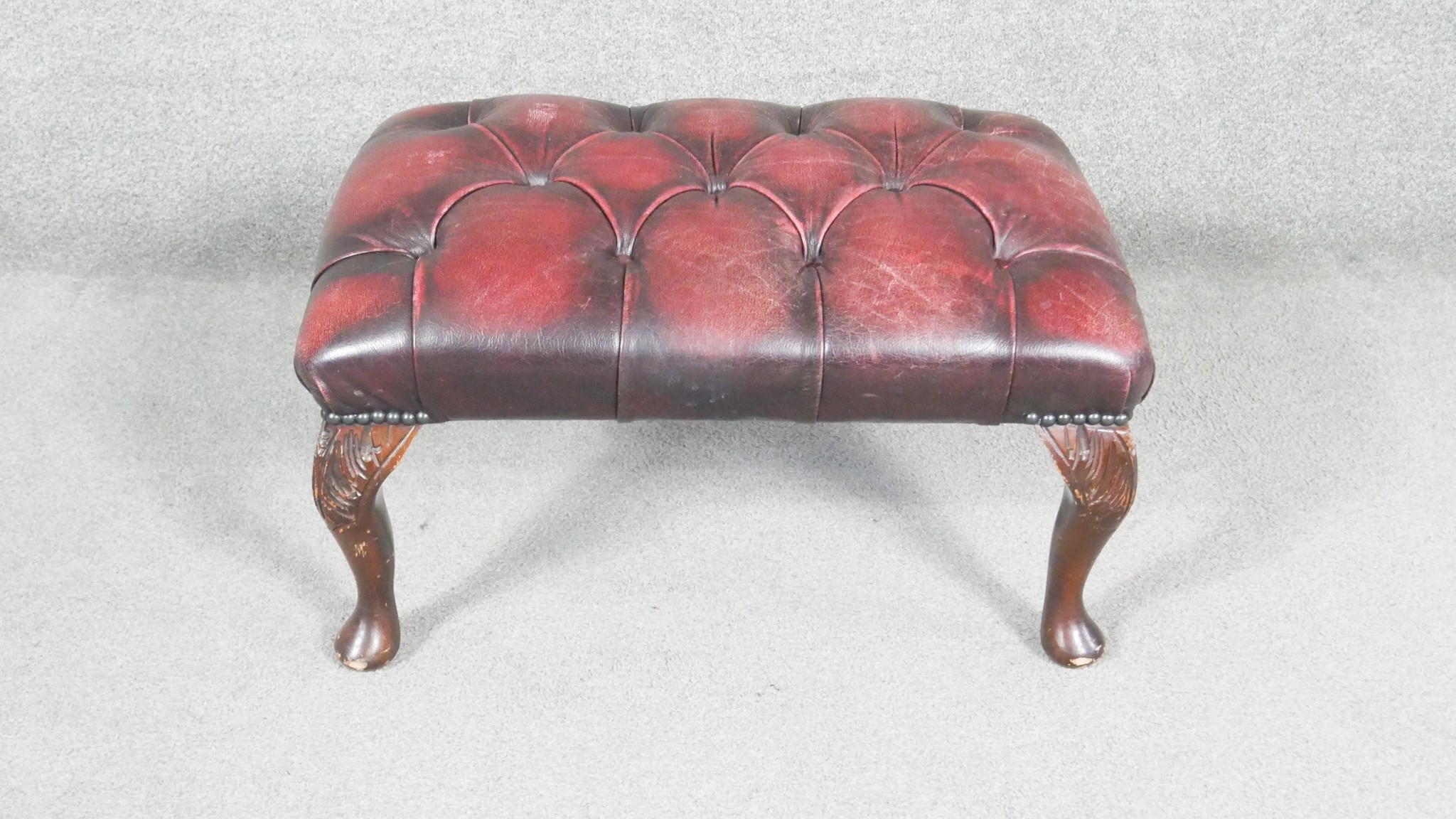 A Georgian style stool in deep buttoned leather upholstery on cabriole supports. H.20 W.65 D.43cm - Image 2 of 6