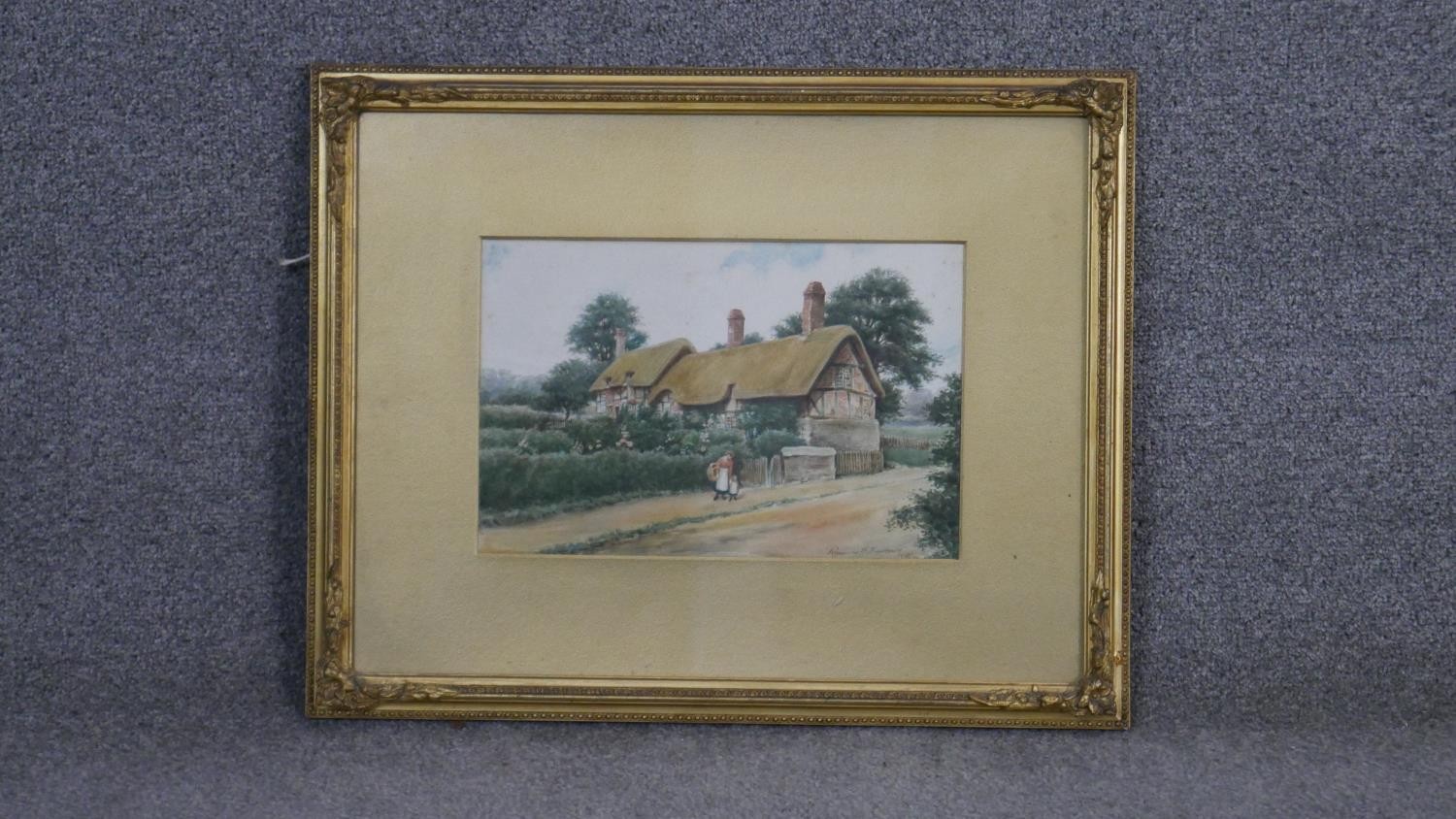 Reginald E Edgecombe- A framed and glazed watercolour of a row of thatched cottages. Signed by - Image 2 of 4