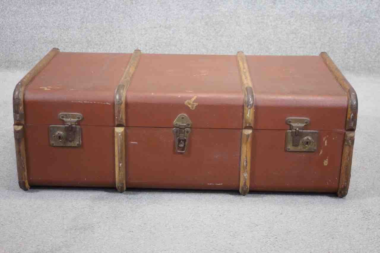 A vintage beech and metal bound travelling trunk.