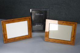 A John Lewis sterling silver easel picture frame along with a pair of marquetry inlaid veneered