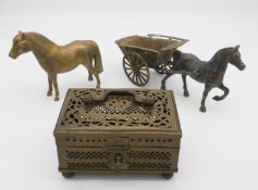 An Indian pierced brass trinket box with carrying handle along with a brass horse and cart and