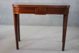 A Georgian mahogany and satinwood chequer inlaid foldover top tea table with double gateleg action