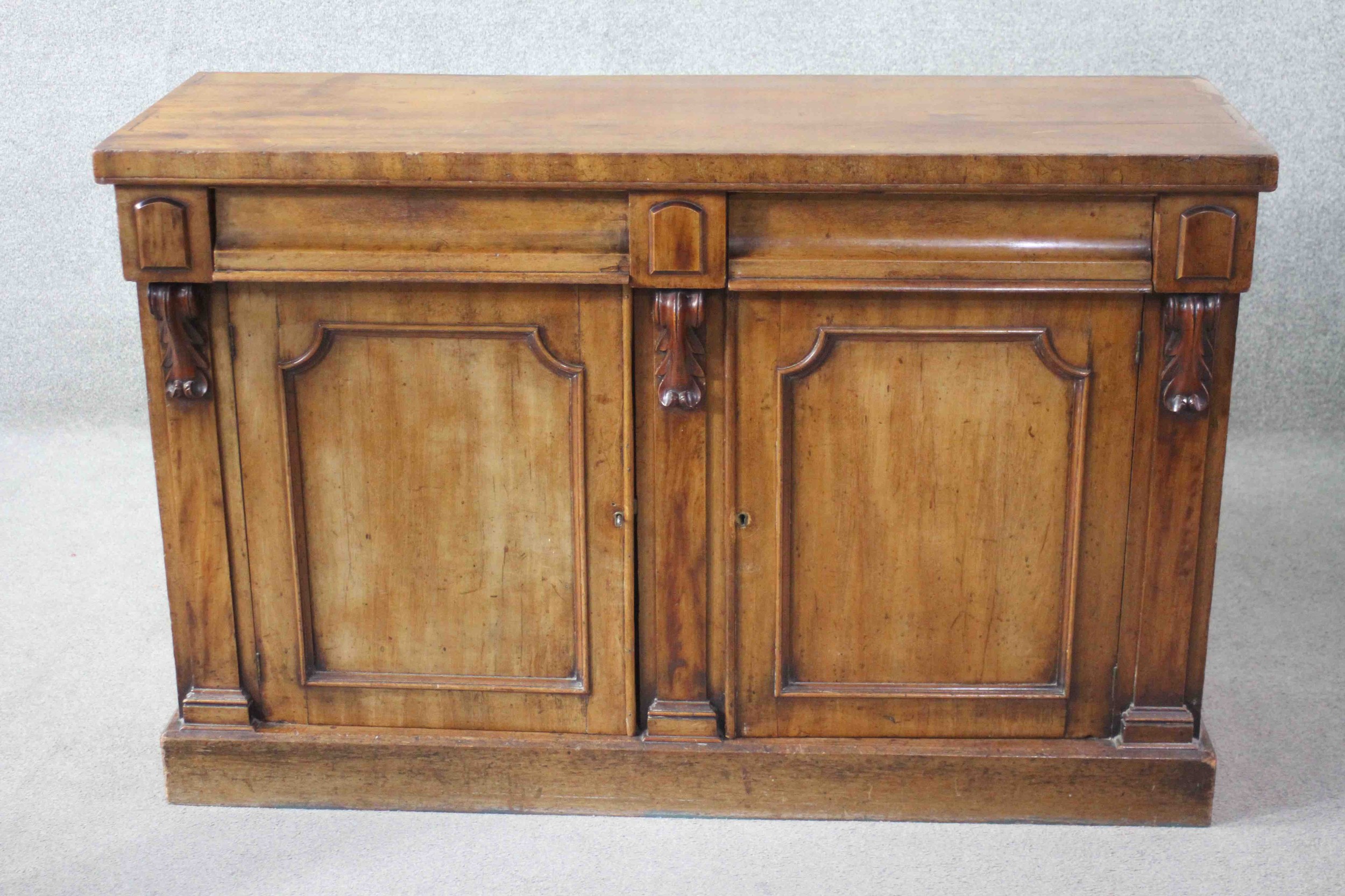 A mid 19th century mahogany sideboard fitted with a pair of drawers and doors on plinth base. H.90