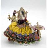 A hand painted 19th century Meissen porcelain figure group by J.J. Kaendler. Depicting a seated lady