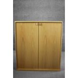 A contemporary light oak Musterring cabinet. H.100 W.90 D.45 cm.