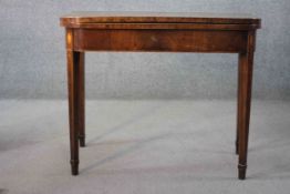A Georgian mahogany and satinwood inlaid card table with foldover baize lined top and gateleg