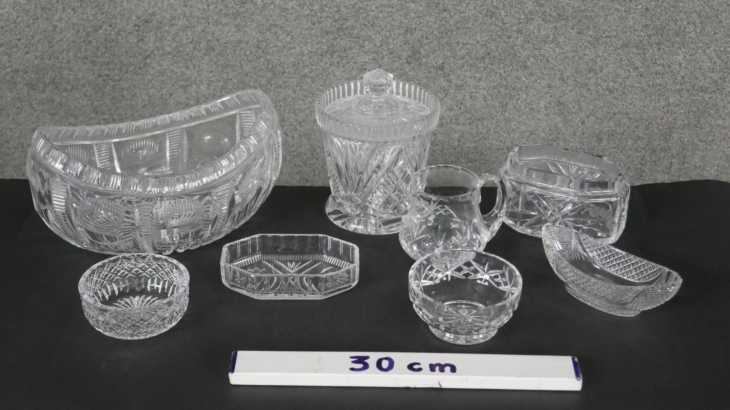 A collection of eight cut crystal pieces. Including a boat shaped crystal bowl, a lidded cut crystal - Image 6 of 6