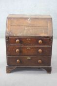 An 18th century country oak bureau with fitted interior on bracket feet. H.95 W.77 D.54 cm.
