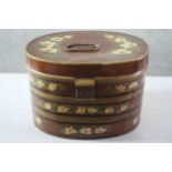 An early 20th century hand painted oval metal lockable hat box. Decorated with mock orange and