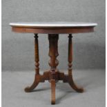 A 19th century Continental walnut centre table with marble top on turned supports on swept quadruped